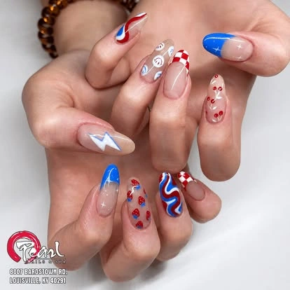 Red white and blue manicure with bows at Pearl Nails ’n Spa