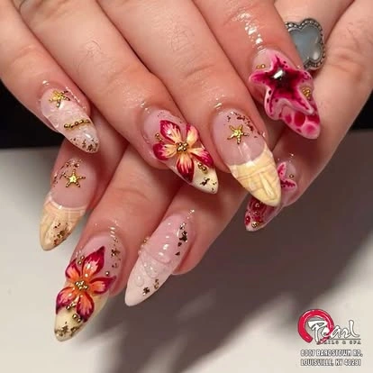 Red and gold floral nail design at Pearl Nails ’n Spa
