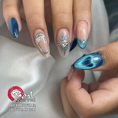Blue cat eye and silver chrome nail art at Pearl Nails ’n Spa
